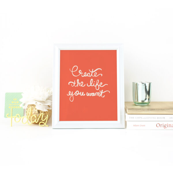 Create the Life You Want Handlettered in Cream on a Tangerine Background on Desk