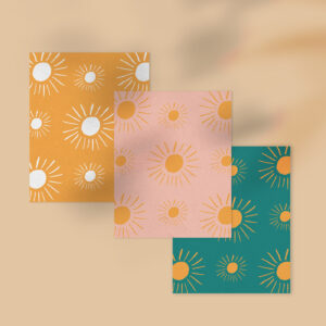 Three different illustrated sun patter notecards on brown background with shadow overlay
