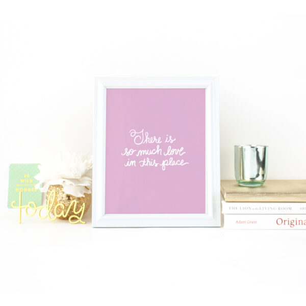 There is So Much Love in this Place Handlettered Print in White on Orchid Purple Background on Desk