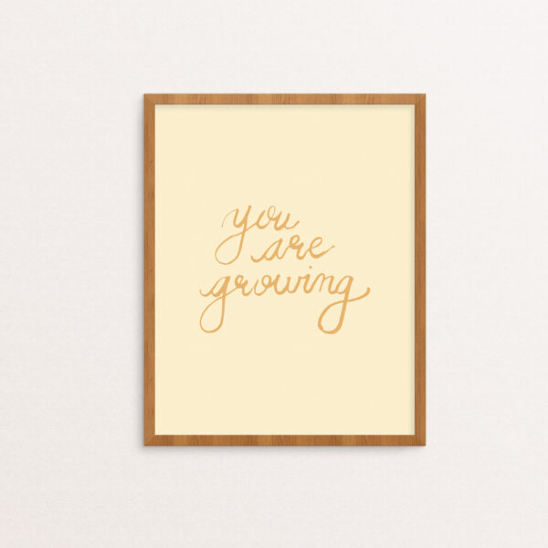 You Are Growing hand-lettered in dandelion yellow on a creme background