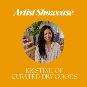 Headshort of Kristine in her office with the title Artist Showcase Kristine of Curated Dry Goods