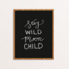 Stay Wild Moon Child Handlettered in White on Black Paper in a Wooden Frame