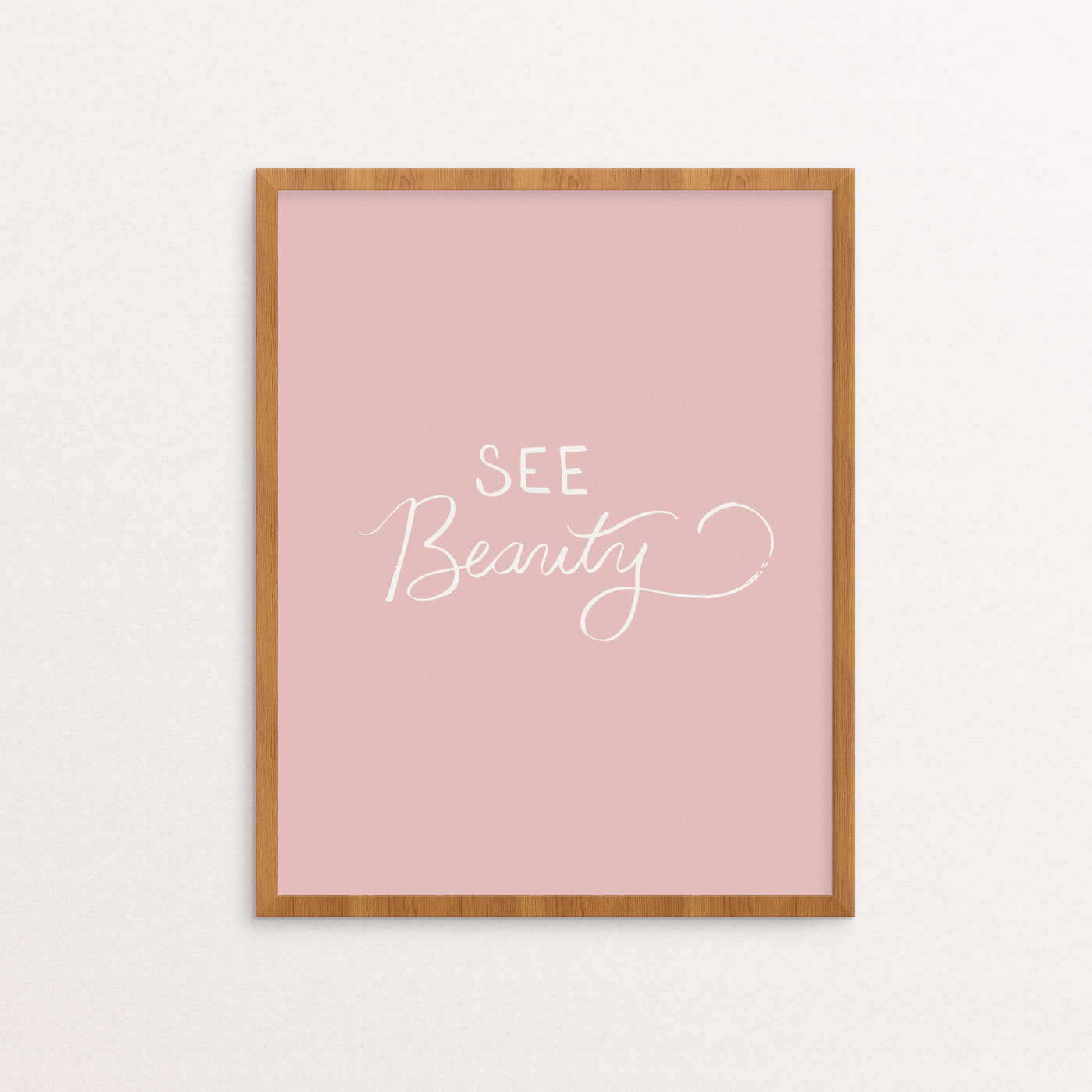 Art print with "See Beauty" hand lettered in white on a soft pink background