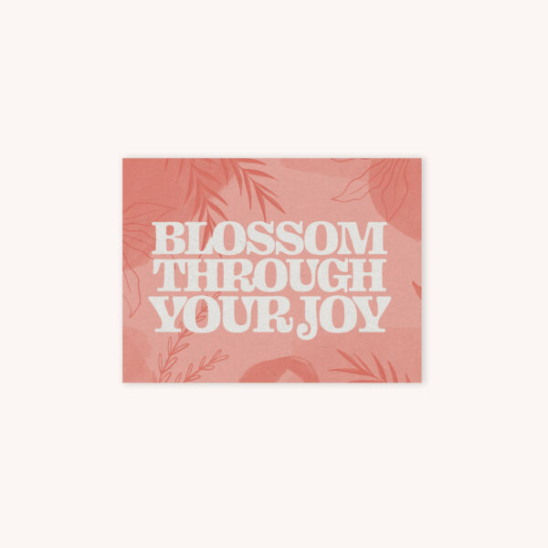 Card that says Blossom Through Your Joy with a pink abstract plant background