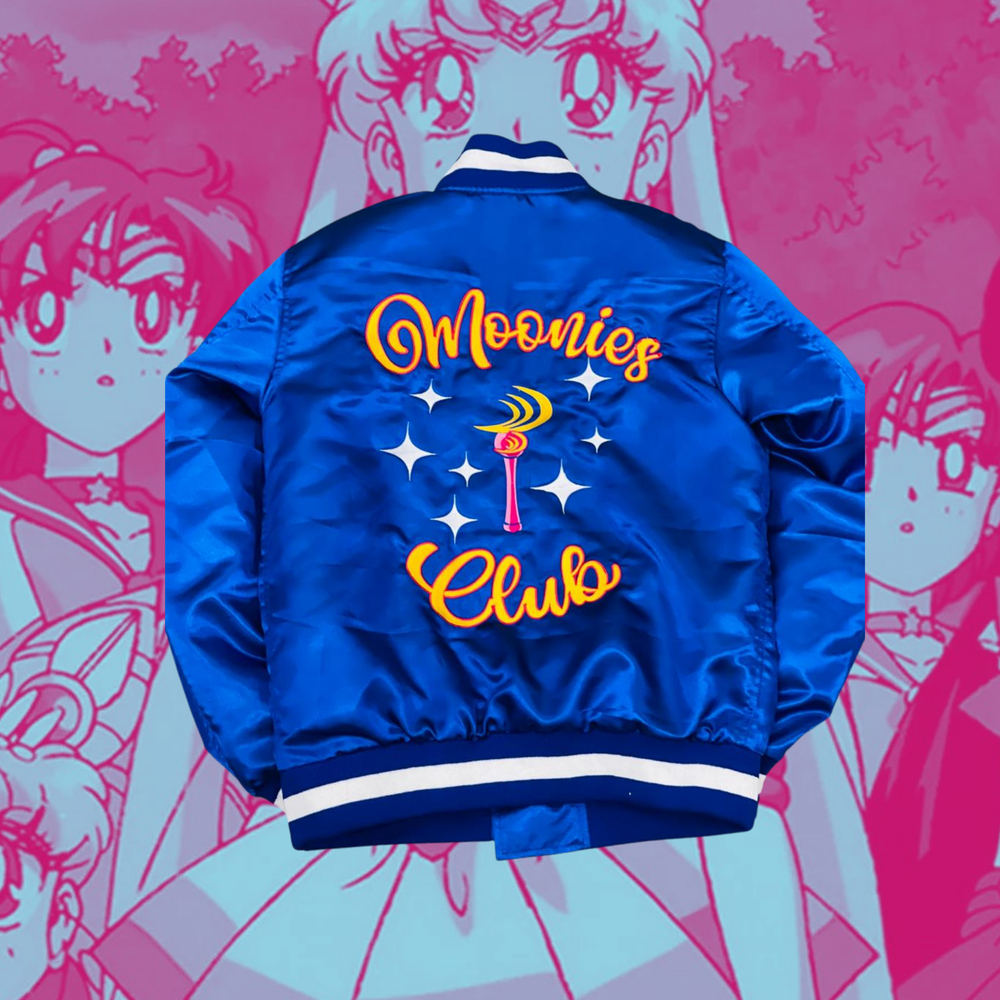 Blue satin bomber jacket with the words Moonies Club on it with a Sailor Moon wand